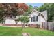 Charming home featuring manicured lawn, mature trees, and classic white siding at 1808 Betry Pl, Raleigh, NC 27603