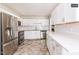 Open-concept kitchen with stainless steel appliances and sleek, modern design at 1808 Betry Pl, Raleigh, NC 27603
