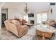 Bright living room featuring vaulted ceilings, fireplace, and elegant furnishings at 1808 Betry Pl, Raleigh, NC 27603