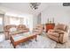 Cozy living room with neutral tones, plush seating, and stylish decor at 1808 Betry Pl, Raleigh, NC 27603