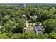 Aerial view of houses with tree coverage, showcasing the surrounding neighborhood at 1820 Park Dr, Raleigh, NC 27605