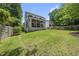 Spacious backyard with a screened-in porch, perfect for outdoor entertaining and relaxation at 1820 Park Dr, Raleigh, NC 27605