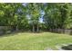Expansive green backyard with mature trees and lush surroundings at 1820 Park Dr, Raleigh, NC 27605