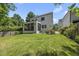 Expansive backyard featuring lush lawn, screened porch, and well-maintained landscaping at 1820 Park Dr, Raleigh, NC 27605
