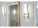 Close up of modern sconces and mirror in bathroom at 1820 Park Dr, Raleigh, NC 27605