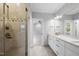 Bright bathroom with glass shower, double sink vanity, and modern fixtures at 1820 Park Dr, Raleigh, NC 27605