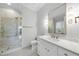 Elegant bathroom with a walk-in shower, white vanity, gold fixtures, and marble countertops at 1820 Park Dr, Raleigh, NC 27605