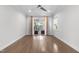 Bright bedroom featuring hardwood floors, a ceiling fan and access to a cozy private balcony at 1820 Park Dr, Raleigh, NC 27605