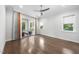 Spacious bedroom with hardwood floors, a ceiling fan, and sliding doors to a balcony at 1820 Park Dr, Raleigh, NC 27605