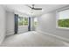 Bedroom featuring neutral walls, patterned carpet, ceiling fan, and natural light at 1820 Park Dr, Raleigh, NC 27605