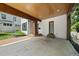 Open carport area showcases a stained wood ceiling and convenient access to the home's entrance at 1820 Park Dr, Raleigh, NC 27605