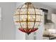 Close-up of a decorative chandelier with crystal embellishments hanging in the kitchen at 1820 Park Dr, Raleigh, NC 27605