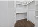 Walk-in closet with custom shelving and hardwood floors at 1820 Park Dr, Raleigh, NC 27605