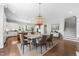 Open-concept kitchen and dining area with modern lighting and stainless appliances at 1820 Park Dr, Raleigh, NC 27605