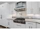 Contemporary kitchen with stainless steel vent hood and professional grade range at 1820 Park Dr, Raleigh, NC 27605