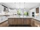 Bright, open kitchen boasts a large island with wooden accents and sleek, modern appliances at 1820 Park Dr, Raleigh, NC 27605
