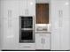 Modern kitchen showcasing stainless steel ovens surrounded by white cabinets at 1820 Park Dr, Raleigh, NC 27605