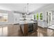 Spacious kitchen featuring a large island, wine cooler, and access to an outdoor space at 1820 Park Dr, Raleigh, NC 27605