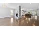 Spacious living room featuring a marble fireplace, open layout, and hardwood floors leading to the kitchen at 1820 Park Dr, Raleigh, NC 27605