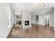 Cozy living room features a marble fireplace, hardwood floors, and ample natural light at 1820 Park Dr, Raleigh, NC 27605