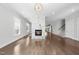 Open-concept living area with a marble fireplace and hardwood floors, perfect for entertaining at 1820 Park Dr, Raleigh, NC 27605