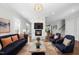Stylish living room with hardwood floors, marble fireplace, and comfortable seating area at 1820 Park Dr, Raleigh, NC 27605