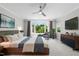 Serene main bedroom features hardwood floors, large windows, and contemporary furnishings at 1820 Park Dr, Raleigh, NC 27605