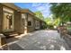 Large brick patio with ample seating, mature trees, and access to the home's interior at 2037 Gurney Ct, Burlington, NC 27215