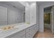 Bathroom featuring a double sink vanity with white cabinets, a white countertop, and gold fixtures at 2037 Gurney Ct, Burlington, NC 27215