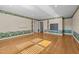 Large bedroom with hardwood floors and unique border, doors, and natural lighting at 2037 Gurney Ct, Burlington, NC 27215
