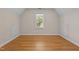 Bright bedroom features hardwood floors, a window for natural light, and access panels at 2037 Gurney Ct, Burlington, NC 27215