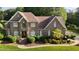 Beautiful two-story brick home with manicured landscaping and a well-maintained lawn at 2037 Gurney Ct, Burlington, NC 27215