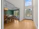 Inviting foyer with gleaming hardwood floors and a grand entry door with sidelights and transom window at 2037 Gurney Ct, Burlington, NC 27215