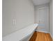 Bright hallway features hardwood floors, a built-in desk, and access to additional rooms at 2037 Gurney Ct, Burlington, NC 27215