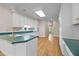 Bright kitchen featuring plenty of counter space, white cabinets, and modern appliances at 2037 Gurney Ct, Burlington, NC 27215