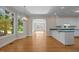 Spacious kitchen and breakfast nook featuring hardwood floors, plenty of natural light and a backyard view at 2037 Gurney Ct, Burlington, NC 27215
