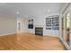 Bright living room with hardwood floors, fireplace, and built-in shelving providing lots of storage at 2037 Gurney Ct, Burlington, NC 27215