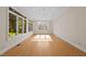 Bright living room featuring hardwood floors, recessed lights, and large windows offering ample natural light at 2037 Gurney Ct, Burlington, NC 27215