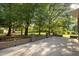 Covered patio with brickwork provides an outdoor living space surrounded by a beautiful green lawn at 2037 Gurney Ct, Burlington, NC 27215