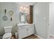 Nicely finished bathroom featuring a white vanity, and updated lighting at 205 Coachman Dr, Garner, NC 27529