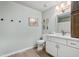 Updated bathroom with white vanity, neutral paint, updated fixtures, and natural light at 205 Coachman Dr, Garner, NC 27529