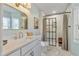 Modern bathroom features marble tiling, a glass shower, and elegant fixtures for a spa-like experience at 205 Coachman Dr, Garner, NC 27529