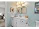 Stylish bathroom with marble vanity, sleek fixtures, and warm lighting, creating a serene atmosphere at 205 Coachman Dr, Garner, NC 27529