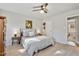 Inviting bedroom with a ceiling fan, a cozy bed, and a neutral color palette, creating a peaceful retreat at 205 Coachman Dr, Garner, NC 27529
