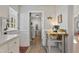 Bright kitchen area with hardwood floors, laundry room and pantry access and stainless steel appliances at 205 Coachman Dr, Garner, NC 27529