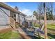 Relaxing patio with outdoor seating adjacent to the home, perfect for entertaining or enjoying the backyard view at 205 Coachman Dr, Garner, NC 27529