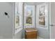 Bright window nook with natural light streaming in, complemented by a wicker hamper, perfect for organizing at 205 Coachman Dr, Garner, NC 27529