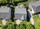 Aerial view of the house showing the surrounding yards, landscaping, and roof at 205 Olive Field Dr, Holly Springs, NC 27540