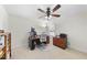 A dedicated office space includes a desk, chair, filing cabinet, and a ceiling fan at 205 Olive Field Dr, Holly Springs, NC 27540