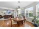 Cozy breakfast nook with large windows providing natural light and backyard views at 205 Olive Field Dr, Holly Springs, NC 27540